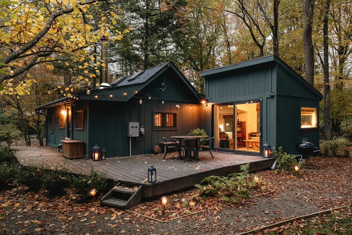 a bird is perched on the balcony of a building